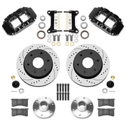 Wilwood Superlite 6R front brake kit, six-lug GM truck/SUV iron ProSpindles, 12.19-inch SRP rotors: Parts layout with two black Superlite 6R calipers, drilled & slotted rotors, separate hubs, black rotor hats, pads, bearings and mounting hardware.
