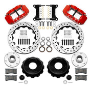 Wilwood Superlite 6R front brake kit, six-lug GM truck/SUV iron ProSpindles, 13.06-inch SRP rotors: Parts layout with two red Superlite 6R calipers, drilled & slotted rotors, separate hubs, black rotor hats, pads, bearings and mounting hardware.