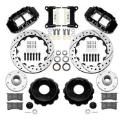 Wilwood Superlite 6R front brake kit, six-lug GM truck/SUV iron ProSpindles, 13.06-inch SRP rotors: Parts layout with two black Superlite 6R calipers, drilled & slotted rotors, separate hubs, black rotor hats, pads, bearings and mounting hardware.