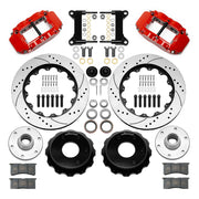 Wilwood Superlite 6R front brake kit, six-lug GM truck/SUV iron ProSpindles, 14-inch SRP rotors: Parts layout with two red Superlite 6R calipers, drilled & slotted rotors, separate hubs, black rotor hats, pads, bearings and mounting hardware.