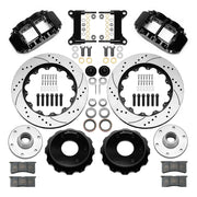 Wilwood Superlite 6R front brake kit, six-lug GM truck/SUV iron ProSpindles, 14-inch SRP rotors: Parts layout with two black Superlite 6R calipers, drilled & slotted rotors, separate hubs, black rotor hats, pads, bearings and mounting hardware.