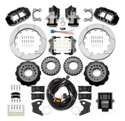 Wilwood Big Ford New Style 2.36-inch-offset axle rear kit laid out with black Superlite 4R service calipers, separate electric parking calipers, 12.88-inch GT-slotted rotors, brackets, pads, wiring harness and controller