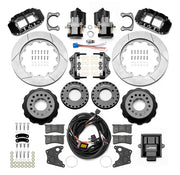 Wilwood Big Ford 2.36-inch-offset axle rear kit laid out with black Superlite 4R service calipers, separate electric parking calipers, 14.00-inch GT-slotted rotors, brackets, pads, wiring harness and controller
