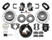 Wilwood Small Ford 2.50-inch-offset axle rear kit laid out with black Dynalite service calipers, separate electric parking calipers, 12.19-inch drilled-and-slotted rotors, brackets, pads, wiring harness and controller