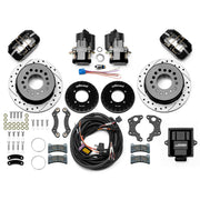 Wilwood 12 Bolt 2.75-inch-offset axle rear kit laid out with black Dynapro Low Profile service calipers, separate electric parking calipers, 11.00-inch drilled-and-slotted rotors, brackets, pads, wiring harness and controller