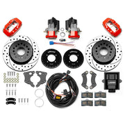Wilwood 12 Bolt 2.75-inch-offset axle rear kit laid out with red Dynalite service calipers, separate electric parking calipers, 12.19-inch drilled-and-slotted rotors, brackets, pads, wiring harness and controller