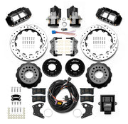 Wilwood 12 Bolt 2.75-inch-offset axle rear kit laid out with black Superlite 4R service calipers, separate electric parking calipers, 12.88-inch drilled-and-slotted rotors, brackets, pads, wiring harness and controller