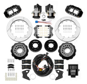 Wilwood 12 Bolt 2.75-inch-offset axle rear kit laid out with black Superlite 4R service calipers, separate electric parking calipers, 12.88-inch GT-slotted rotors, brackets, pads, wiring harness and controller