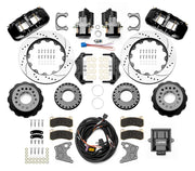 Wilwood Big Ford New Style 2.36-inch-offset axle rear kit laid out with black AERO4 service calipers, separate electric parking calipers, 14.00-inch drilled-and-slotted rotors, brackets, pads, wiring harness and controller