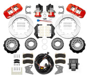 Wilwood Big Ford New Style 2.36-inch-offset axle rear kit laid out with red AERO4 service calipers, separate electric parking calipers, 14.00-inch GT-slotted rotors, brackets, pads, wiring harness and controller
