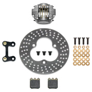 Wilwood left-front sprint with aluminum rotor kit laid out with a gray caliper, drilled aluminum rotor, pads, bracket and hardware