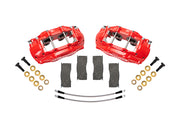 Wilwood front D11 brake kit for Ford/Mercury disc spindles: Two red-finish D11 calipers arranged with four brake pads, two braided hoses, bolts and washers; no rotors are shown.