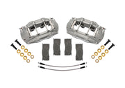Wilwood front D11 brake kit for Ford/Mercury disc spindles: Two gray anodized D11 calipers arranged with four brake pads, two braided hoses, bolts and washers; no rotors are shown.