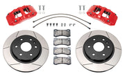 Wilwood front AERODM brake kit for early GM 1500 trucks: Two red-finish AERODM calipers with slotted one-piece rotors, brake pads and mounting fasteners, braided hoses and fittings laid out.