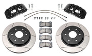 Wilwood front AERODM brake kit for early GM 1500 trucks: Two black AERODM calipers with slotted one-piece rotors, brake pads and mounting fasteners, braided hoses and fittings laid out.