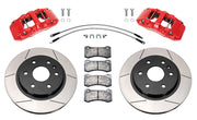 Wilwood front AERODM brake kit for current-body GM 1500 applications: Two red-finish AERODM calipers with slotted one-piece rotors, brake pads and mounting fasteners, braided hoses and fittings laid out.