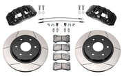 Wilwood front AERODM brake kit for Ford F-150/Expedition and Lincoln Navigator: Two black AERODM calipers with slotted one-piece rotors, brake pads and mounting fasteners, braided hoses and fittings laid out.