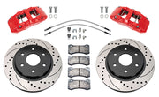 Wilwood front AERODM brake kit for Ford F-150 Raptor 2017–2020: Two red-finish AERODM calipers with drilled and slotted one-piece rotors, brake pads and mounting fasteners, braided hoses and fittings laid out.