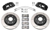 Wilwood front AERODM brake kit for Ford F-150 Raptor 2017–2020: Two black AERODM calipers with slotted one-piece rotors, brake pads and mounting fasteners, braided hoses and fittings laid out.