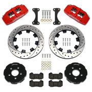 Wilwood front Dynapro 6 brake kit for PT Cruiser/Neon SRT-4: Parts layout with two red-finish Dynapro 6 calipers, drilled and slotted rotor rings, separate black hats, pads, brackets and fasteners.