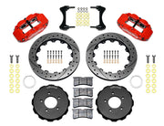 Wilwood front FNSL6R brake kit for Honda Civic/Acura Integra street package: Parts layout with two red-finish FNSL6R calipers, drilled and slotted rotor rings, separate black hats, pads, brackets and fasteners, with braided hoses.