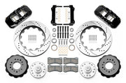 Wilwood front AERO6 brake kit for Tri-Five ProSpindle AERO6 conversion: Two black AERO6 calipers, drilled and slotted rotor rings, separate black hats, silver hubs, bearings, seals, pads, brackets and hardware laid out.