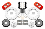 Wilwood front AERO6 brake kit for Tri-Five ProSpindle AERO6 conversion: Two red-finish AERO6 calipers, slotted rotor rings, separate black hats, silver hubs, bearings, seals, pads, brackets and hardware laid out.