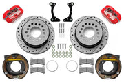 Wilwood rear Forged Dynapro Low Profile brake kit for staggered BOP 11-inch configuration: Red-finish caliper pair with drilled and slotted rotors, internal drum parking-brake assemblies, brackets, pads, registration rings and fasteners.