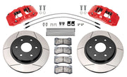 Wilwood front AERODM brake kit for Ford F-150 2021–2025: Two red-finish AERODM calipers with slotted one-piece rotors, brake pads and mounting fasteners, braided hoses and fittings laid out.