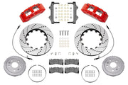 Wilwood front SX6R brake kit for Corvette C8: Parts layout with two red-finish SX6R calipers, drilled and slotted rotor rings, separate silver hats, pads, brackets and fasteners, with braided hoses.