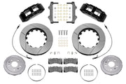Wilwood front SX6R brake kit for Corvette C8: Parts layout with two black SX6R calipers, slotted rotor rings, separate silver hats, pads, brackets and fasteners, with braided hoses.