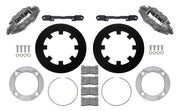 Wilwood front UTV6 brake kit for Polaris RZR Turbo/PRO XP: Two gray anodized UTV6 calipers with black solid rotor rings, silver adapters, mounting brackets, brake pads, retaining rings and fasteners.