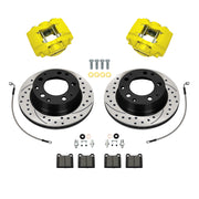 Wilwood Porsche 911 (1984–1989) rear 11.42 × 0.95-inch srp drilled & slotted brake kit layout with yellow D31 calipers and rotors, pads and fasteners, with braided hoses