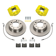 Wilwood Porsche 911 (1984–1989) rear 11.42 × 0.95-inch plain face brake kit layout with yellow D31 calipers and rotors, pads and fasteners, with braided hoses
