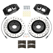 Wilwood Corvette C5 front brake kit with black SLC56 calipers and 12.80-inch drilled and slotted rotors, laid out with pads, flexlines, washers and mounting hardware