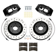 Wilwood Corvette C6 Base front brake kit with black SLC56 calipers and 12.80-inch drilled and slotted rotors, laid out with pads, flexlines, washers and mounting hardware