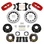 Wilwood Chevrolet and GMC C1500 rear brake kit with red AERO4 calipers and 14.00-inch drilled and slotted rotors, laid out with parking-shoe assemblies, hats, pads, brackets and fasteners