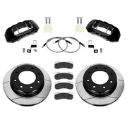 Wilwood Ford Super Duty 2023–2025 front brake kit with black TX6-DM calipers and 15.00-inch slotted rotors, laid out with pads, braided flexlines and mounting hardware