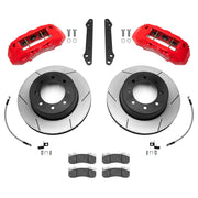 Wilwood Ford Super Duty 2023–2025 rear brake kit with red TX6-DM calipers and 15.50-inch slotted rotors, laid out with pads, braided flexlines and mounting hardware