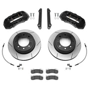 Wilwood Ford Super Duty 2023–2025 rear brake kit with black TX6-DM calipers and 15.50-inch slotted rotors, laid out with pads, braided flexlines and mounting hardware