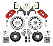 Wilwood Chevrolet full-size drum-spindle front brake kit with red AERO6 calipers and 14.00-inch drilled and slotted rotors, laid out with hats, hubs, bearings, seals, pads, brackets and hardware