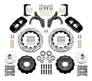Wilwood Chevrolet full-size drum-spindle front brake kit with black AERO6 calipers and 14.00-inch drilled and slotted rotors, laid out with hats, hubs, bearings, seals, pads, brackets and hardware