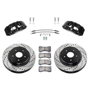 Wilwood Ram 1500 2WD front brake kit with black AERODM calipers and 13.38-inch drilled and slotted rotors, laid out with pads, braided hoses and mounting fasteners
