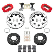 Wilwood aluminum ProSpindle front brake kit with red Dynalite calipers and 12.19-inch drilled and slotted rotors, laid out with hats, registration rings, pads, brackets and fasteners