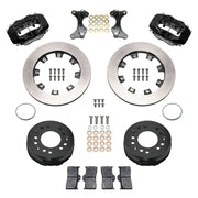 Wilwood aluminum ProSpindle front brake kit with black Dynalite calipers and 12.19-inch plain rotors, laid out with hats, registration rings, pads, brackets and fasteners