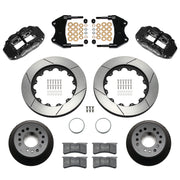 Wilwood aluminum ProSpindle front brake kit with black FNSL6R calipers and 14.00-inch slotted rotors, laid out with hats, registration rings, pads, brackets and fasteners
