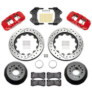 Wilwood aluminum ProSpindle front brake kit with red AERO6 calipers and 15.00-inch drilled and slotted rotors, laid out with hats, registration rings, pads, brackets and fasteners
