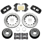 Wilwood aluminum ProSpindle front brake kit with black AERO6 calipers and 15.00-inch drilled and slotted rotors, laid out with hats, registration rings, pads, brackets and fasteners