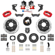 Wilwood Chevrolet and GMC C1500 rear brake kit with red Dynalite calipers and 12.19-inch drilled and slotted rotors, laid out with separate electric parking calipers, controller, harness, brackets, pads and hardware