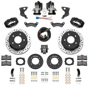 Wilwood Chevrolet and GMC C1500 rear brake kit with black Dynalite calipers and 12.19-inch drilled and slotted rotors, laid out with separate electric parking calipers, controller, harness, brackets, pads and hardware